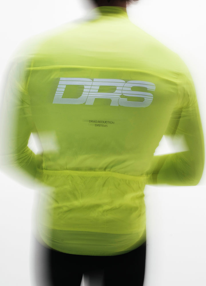 Neon yellow cycling insulated jacket with 'DRS' logo on the back against a white background